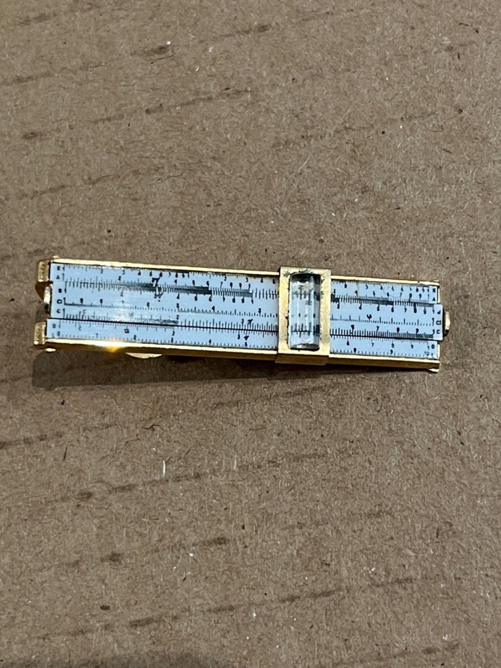 SWANK Gold Tone Slide Rule Tie Bar with White Dial Detailing